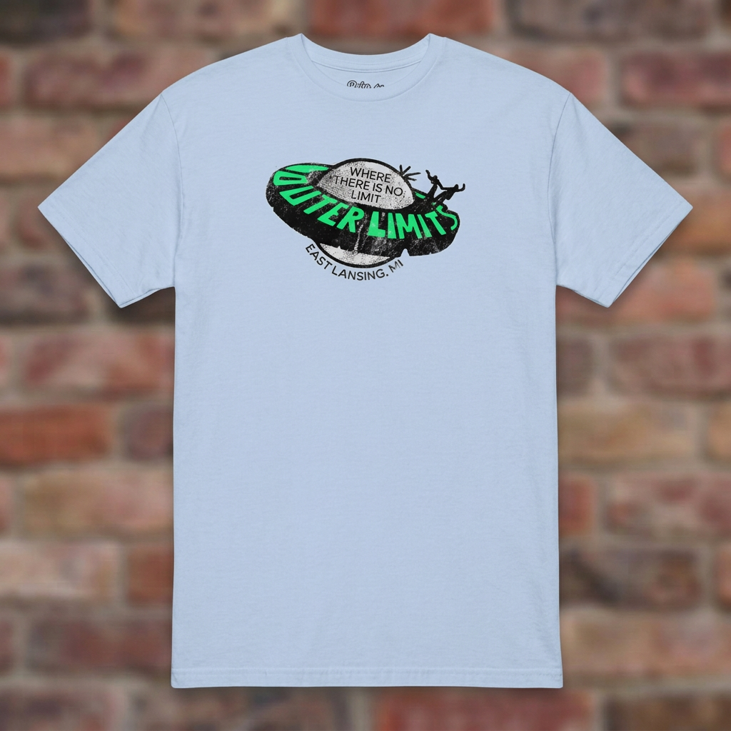 Outer Limits Light Blue T-shirt flat lay on brick background