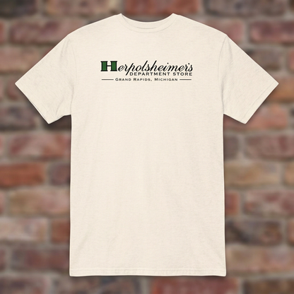 Herpolsheimer's Natural T-shirt flat lay on brick background