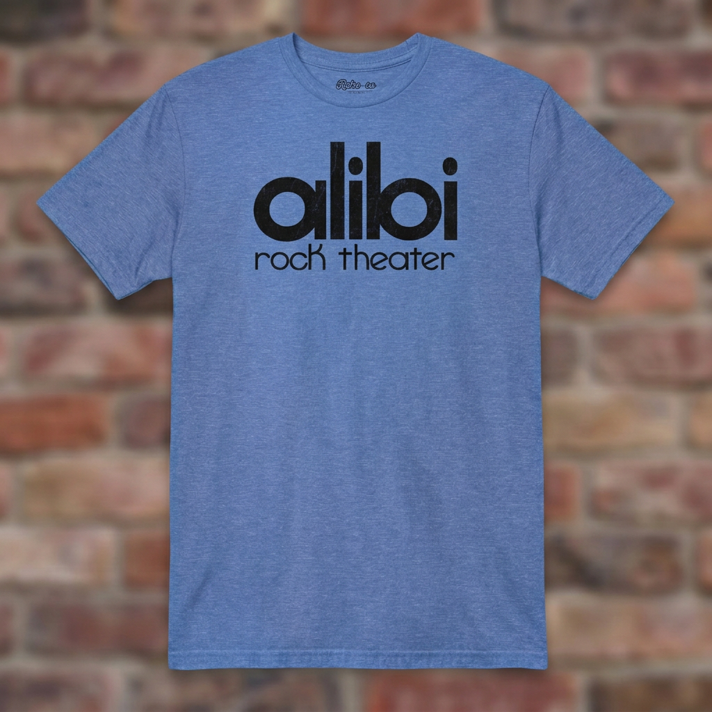 Alibi Rock Theater Heather Royal T-shirt flat lay on brick background