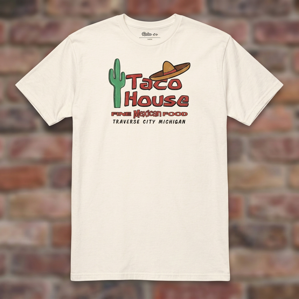 Taco House Traverse City Natural T-shirt flat lay on brick background