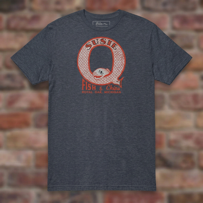 Susie Q Fish-n-Chips Heather Navy T-shirt flat lay on brick background