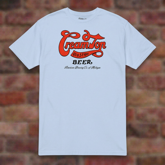 Creamtop Old Style Beer Light Blue T-shirt flat lay on brick background