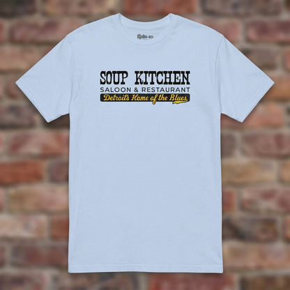 Soup Kitchen Saloon Light Blue T-shirt flat lay on brick background
