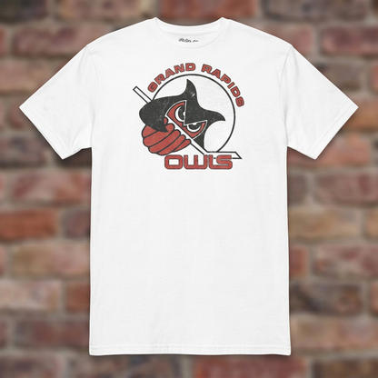 Grand Rapids Owls Hockey White T-shirt flat lay on brick background