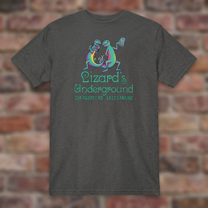 Lizard's Underground East Lansing Dark Heather Grey T-shirt flat lay on brick background