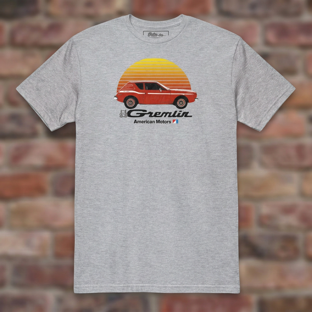 AMC Gremlin Sport Grey T-shirt flat lay on brick background