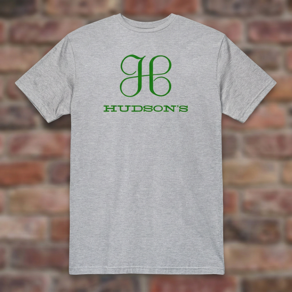 Hudson's Dept Store Detroit T-shirt in Sport Grey, flat lay on warm brick background