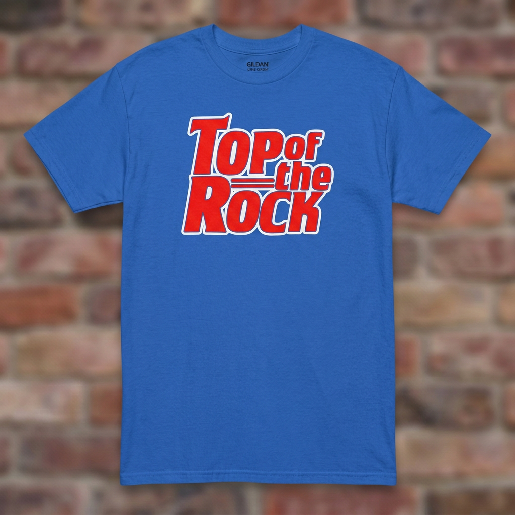 Top of the Rock Royal T-shirt flat lay on brick background