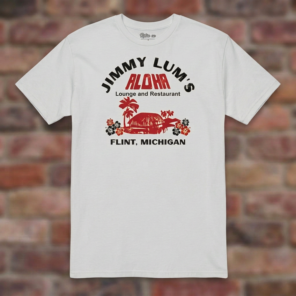 Jimmy Lum's Ice Grey T-shirt flat lay on brick background