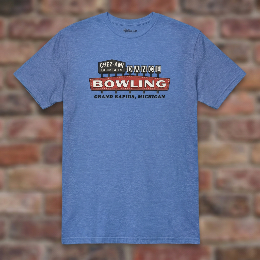 Chez-Ami Lanes Heather Royal T-shirt flat lay on brick background