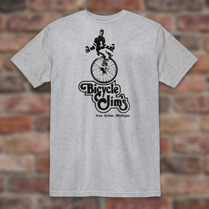 Bicycle Jim's Sport Grey T-shirt flat lay on brick background