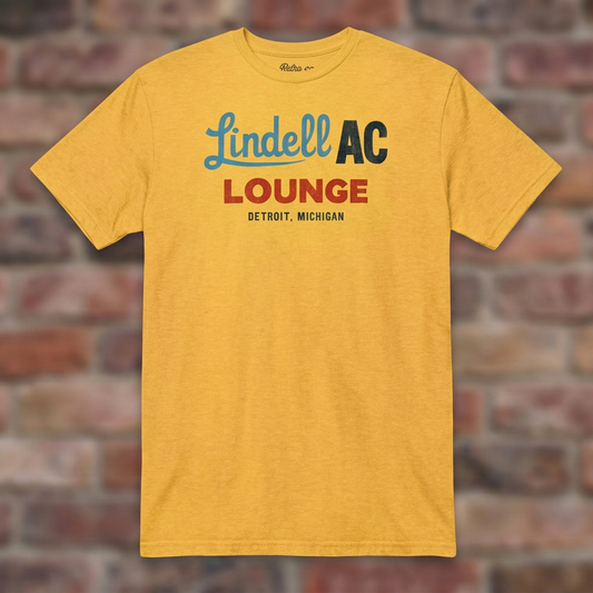 Daisy Lindell AC Lounge Detroit T-shirt flat-lay against weathered brick