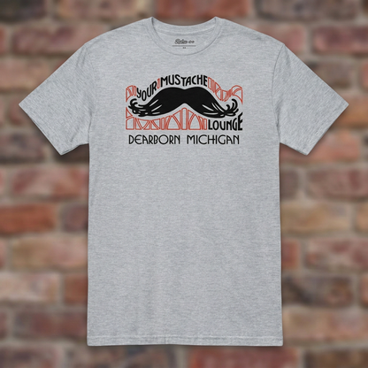 Your Mustache Lounge Dearborn Sport Grey T-shirt flat lay on brick background