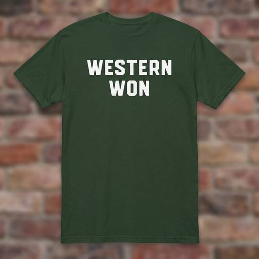 Western Won Spartan Style Forest Green T-shirt flat lay on brick background