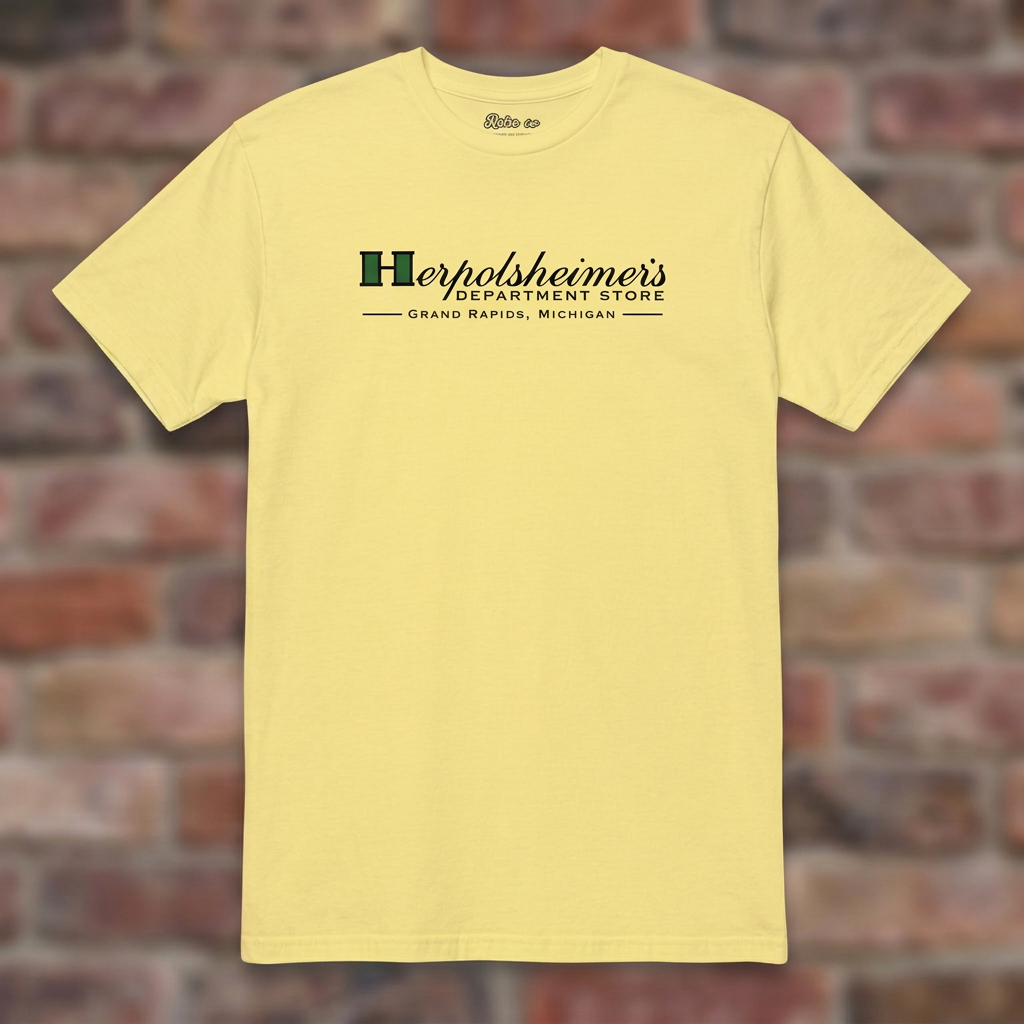 Herpolsheimer's Cornsilk T-shirt flat lay on brick background