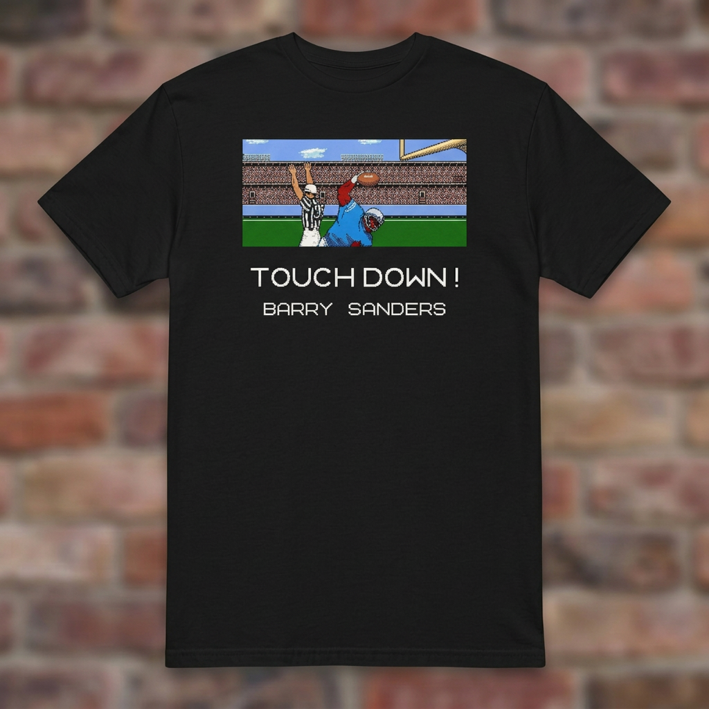Touchdown Barry 8-Bit Black T-shirt flat lay on brick background