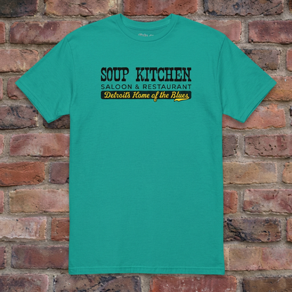 Soup Kitchen Saloon Jade Dome T-shirt flat lay on brick background