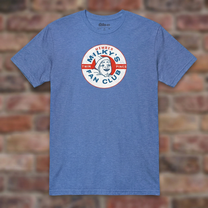 Milky the Clown Fan Club T-shirt in Heather Royal, flat lay on warm brick background