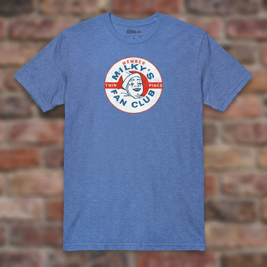 Milky the Clown Fan Club T-shirt in Heather Royal, flat lay on warm brick background
