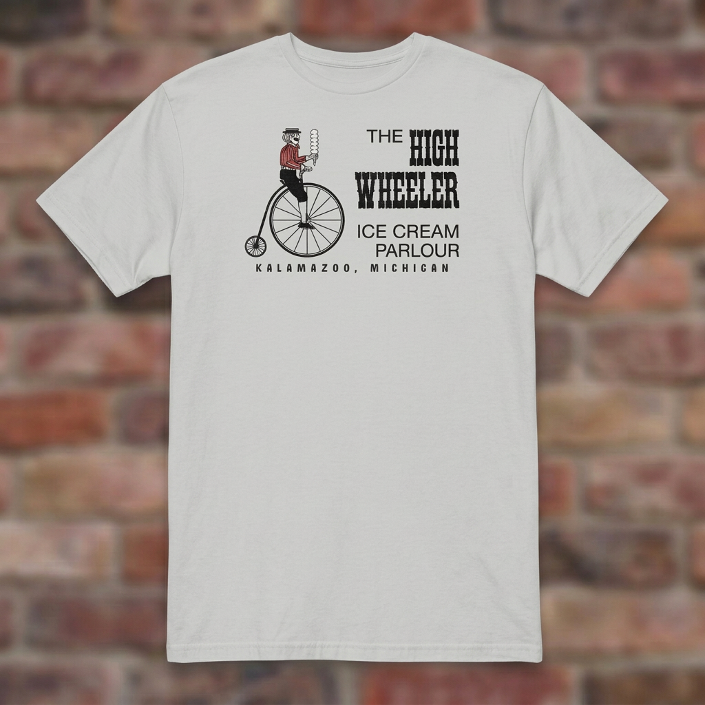 High Wheeler Ice Grey T-shirt flat lay on brick background