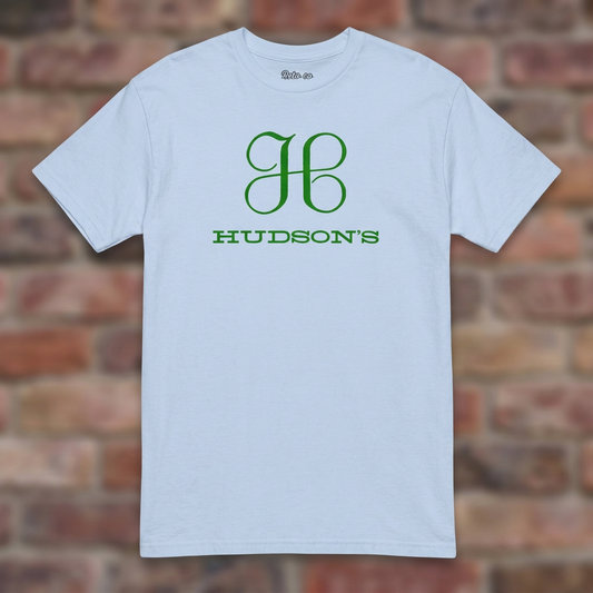 Hudson's Dept Store Detroit T-shirt in Light Blue, flat lay on warm brick background
