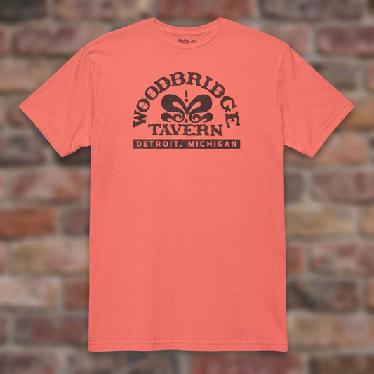 Woodbridge Tavern Coral Silk T-shirt flat lay on brick background