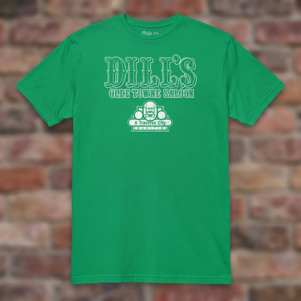 Dill’s Olde Towne Saloon Irish Green T-shirt flat lay on brick background