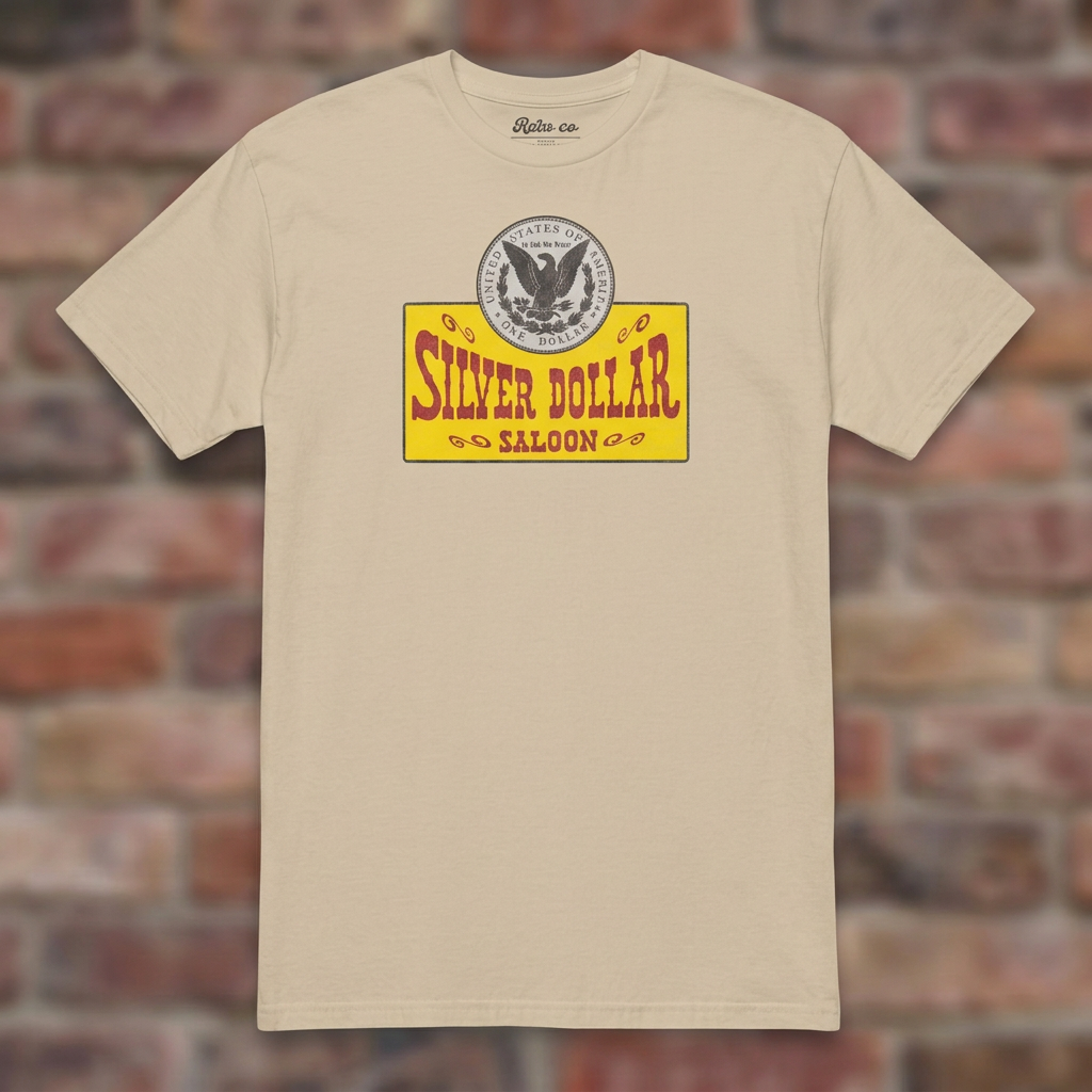 Silver Dollar Saloon Sand T-shirt flat lay on warm brick