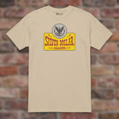 Silver Dollar Saloon Sand T-shirt flat lay on warm brick