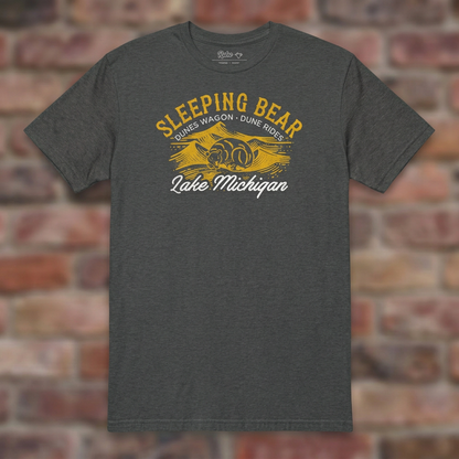 Sleeping Bear Dune Rides Dark Heather Grey T-shirt flat lay on brick background
