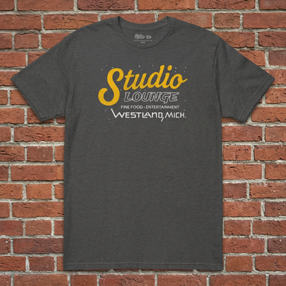 Studio Lounge Dark Heather Grey T-shirt flat lay on brick background