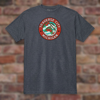 Traverse City Michigan Heather Navy T-shirt flat lay on brick background