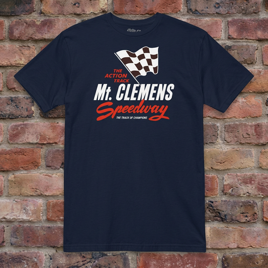 Mt. Clemens Speedway Navy T-shirt flat lay on weathered brick background
