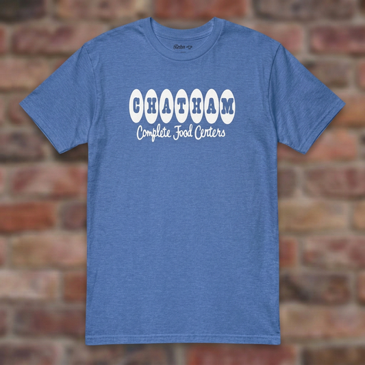 Chatham Heather Royal T-shirt flat lay on brick background