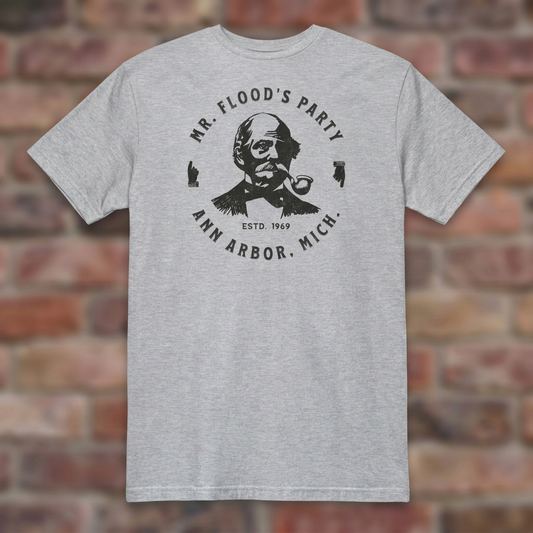 Mr. Flood's Party Sport Grey T-shirt flat lay on warm brick