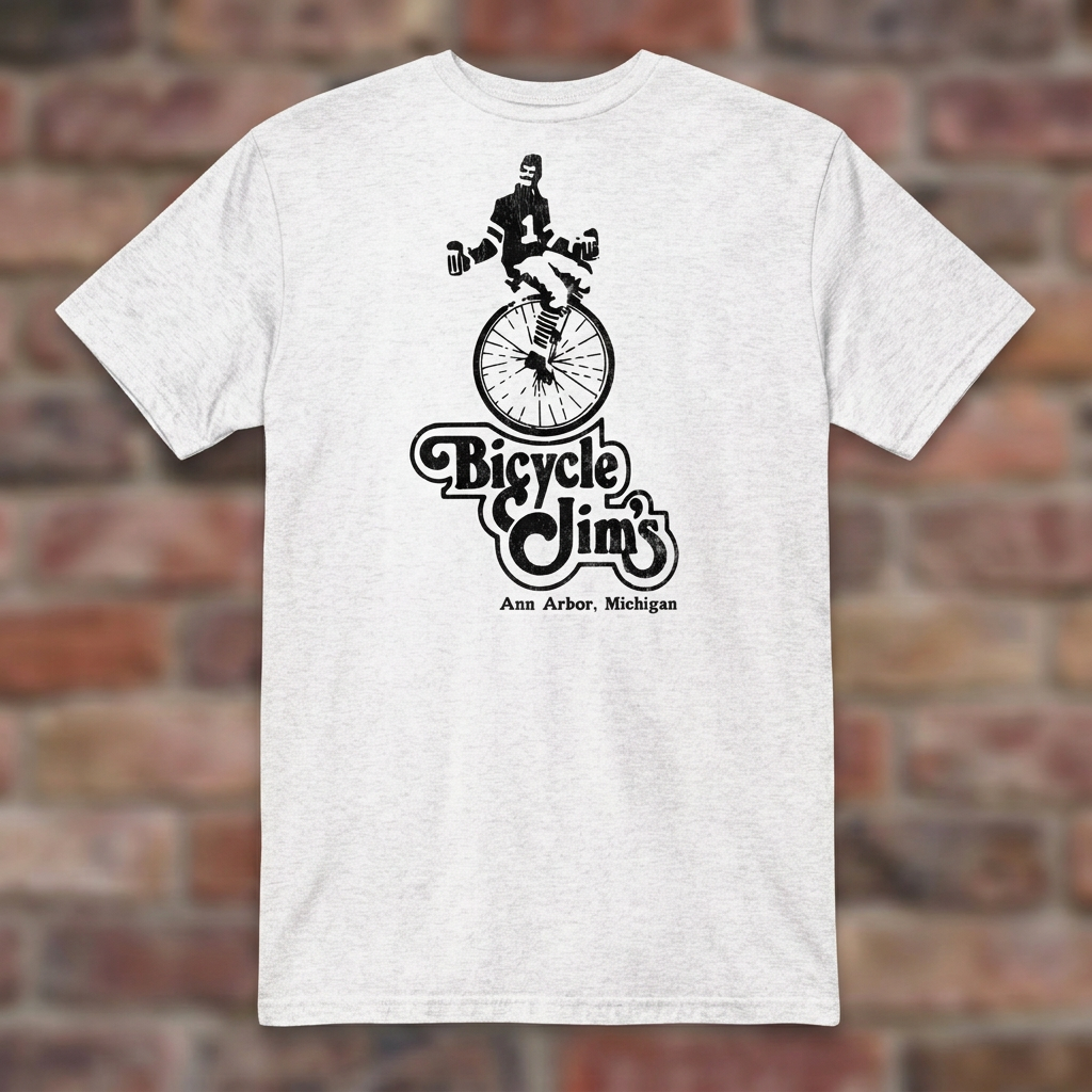 Bicycle Jim's White T-shirt flat lay on brick background