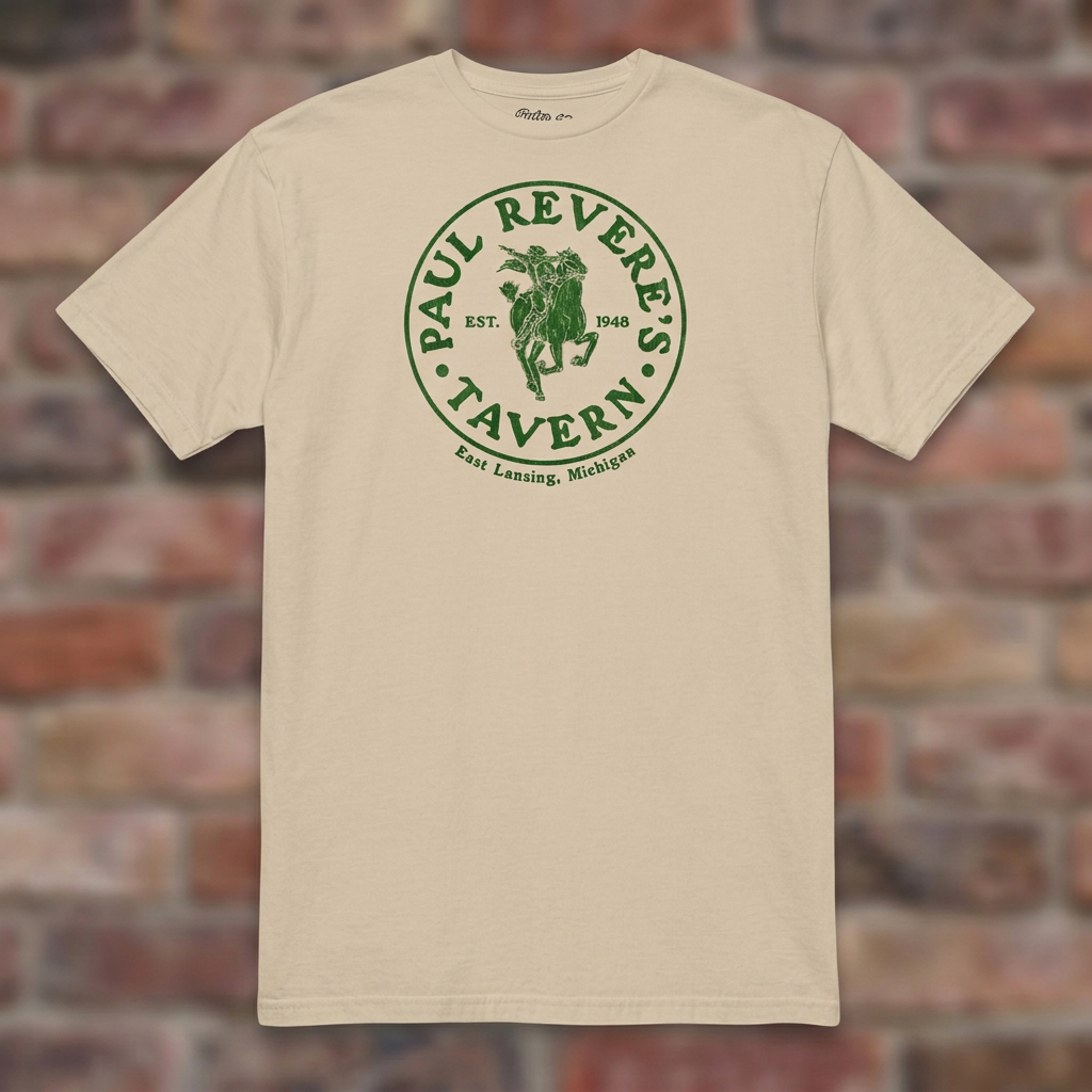 Paul Revere's Tavern Sand T-shirt flat lay on warm brick