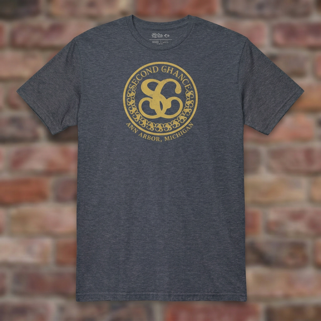 Second Chance Heather Navy T-shirt flat lay on brick background