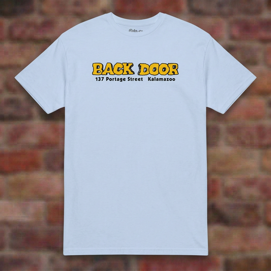 Back Door Light Blue T-shirt flat lay on brick background