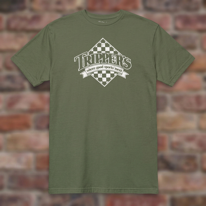 Trippers Lansing Military Green T-shirt flat lay on brick background