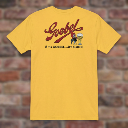 Daisy Goebel T-shirt flat lay on warm brick background