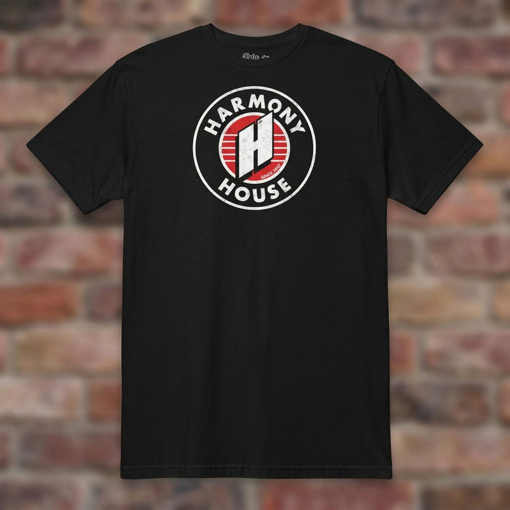 Harmony House Black T-shirt flat lay on warm brick
