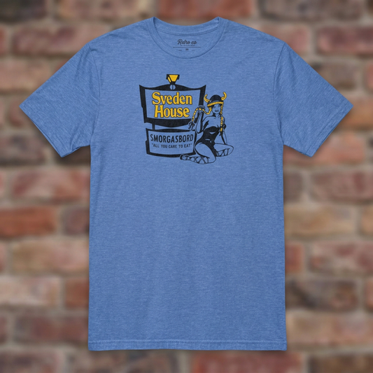 Sveden House Heather Royal T-shirt flat lay on brick background