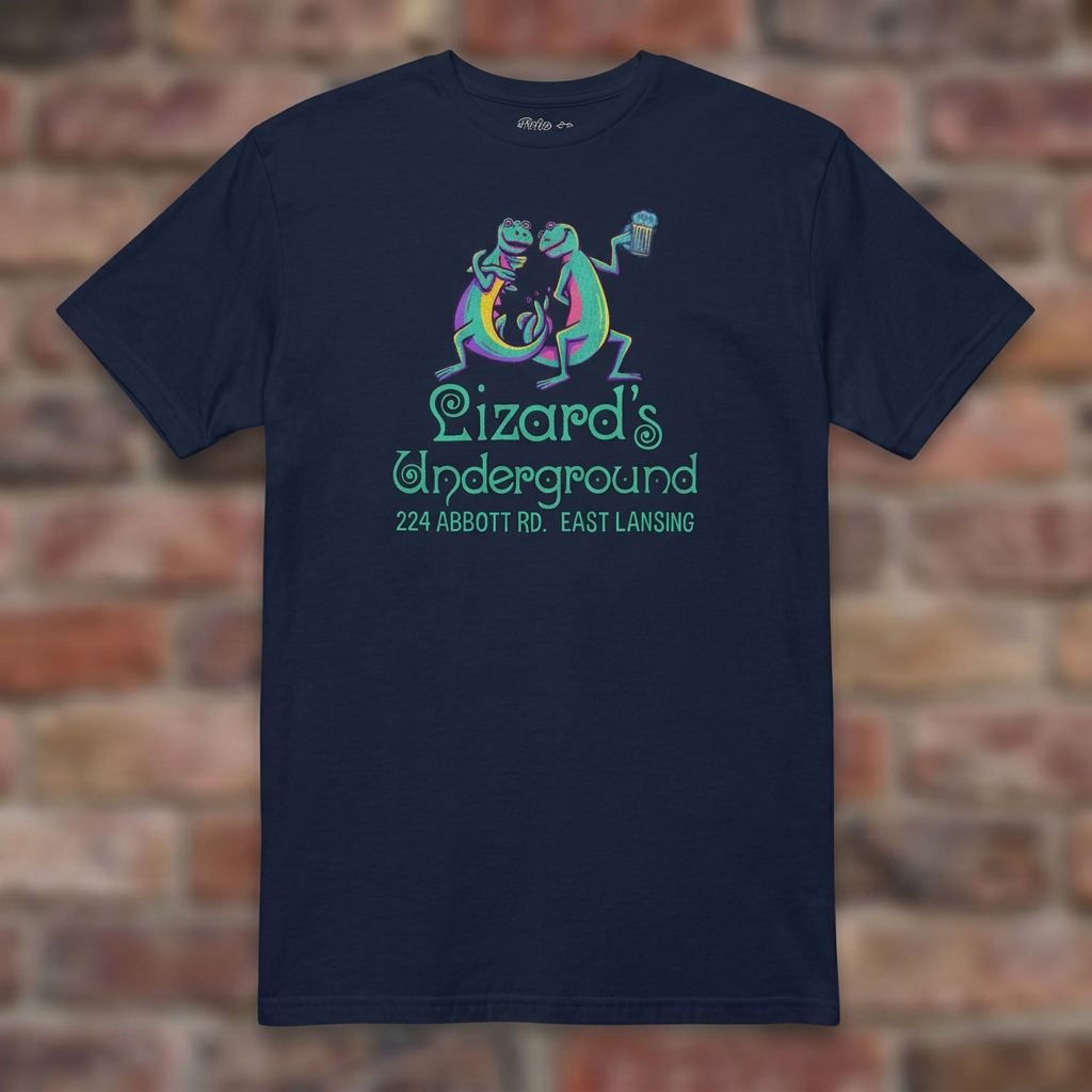 Lizard's Underground East Lansing Navy T-shirt flat lay on brick background