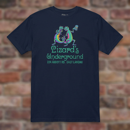 Lizard's Underground East Lansing Navy T-shirt flat lay on brick background