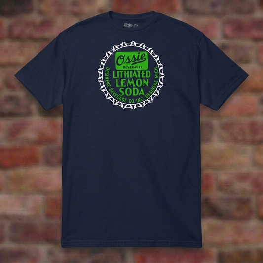 Ossie Beverages Navy T-shirt flat lay on brick background