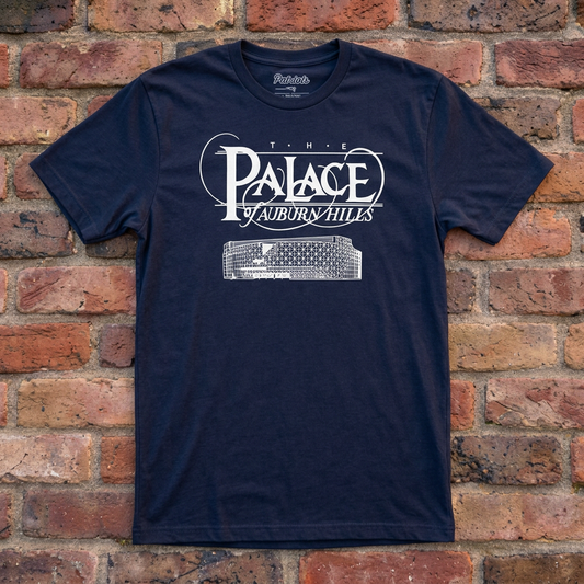 Navy Palace of Auburn Hills T-shirt flat lay on warm brick