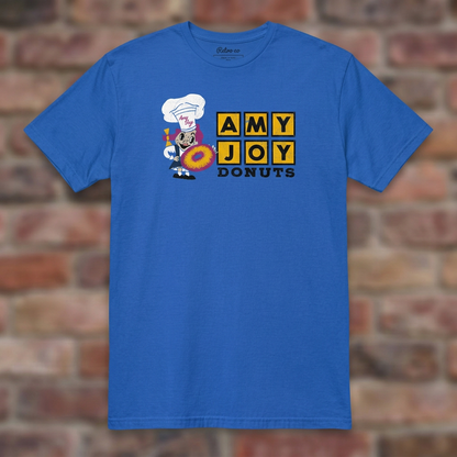 Amy Joy Donuts Royal T-shirt flat lay on brick background