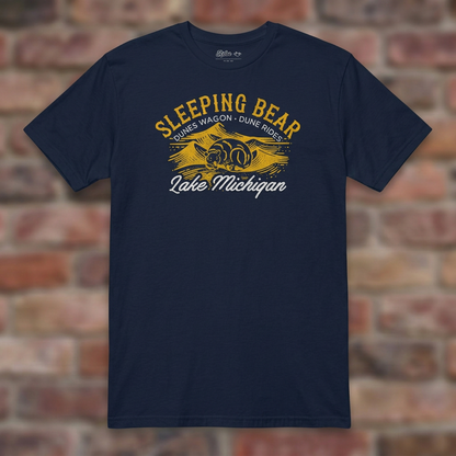 Sleeping Bear Dune Rides Navy T-shirt flat lay on brick background