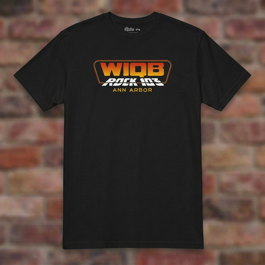 WIQB Rock 103 Black T-shirt flat lay on brick background